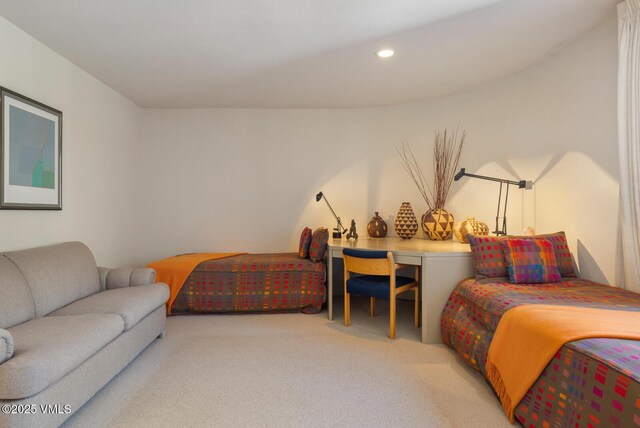 bedroom featuring light colored carpet