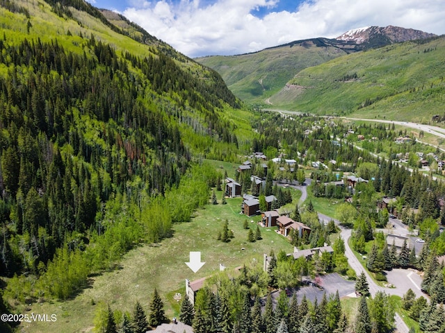 4524 Meadow Dr Unit 905, Vail, CO 81657 - aerial overview of property's location with a mountainous background and a heavily wooded area