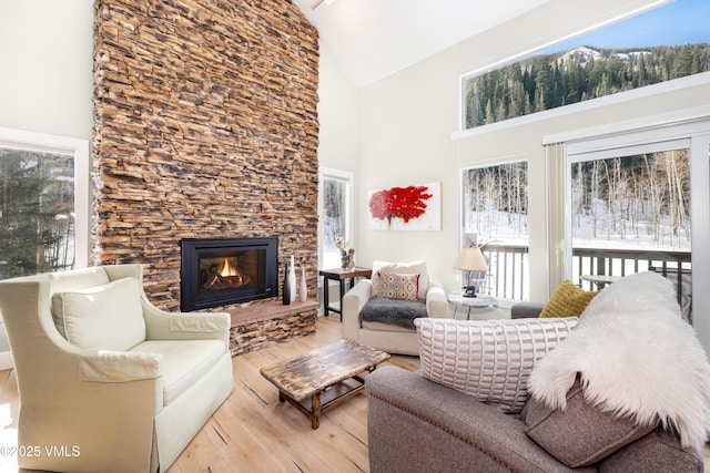 4524 Meadow Dr Unit 905, Vail, CO 81657 - living area featuring high vaulted ceiling, hardwood / wood-style flooring, and a fireplace