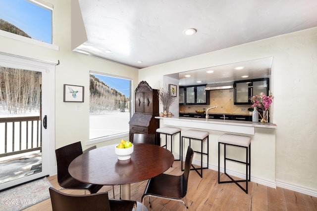 4524 Meadow Dr Unit 905, Vail, CO 81657 - dining area with hardwood / wood-style floors, recessed lighting, and baseboards