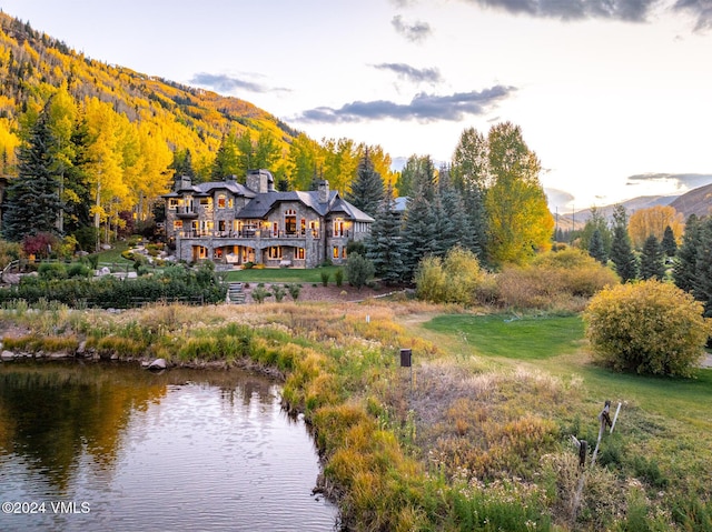 exterior space featuring a water and mountain view