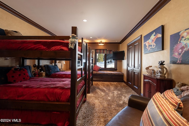 carpeted bedroom featuring crown molding