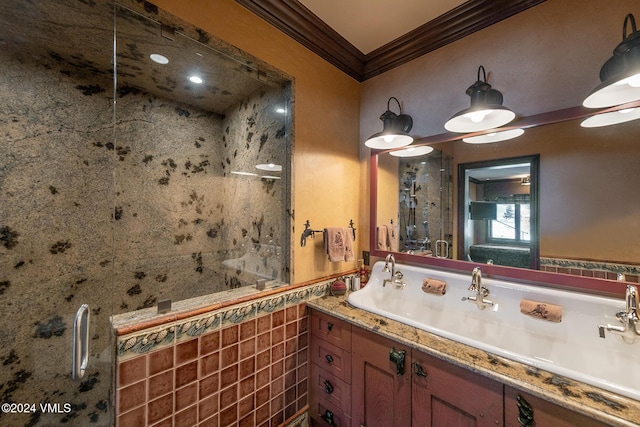 bathroom with crown molding, vanity, and an enclosed shower