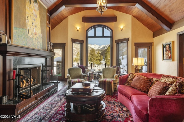 living room featuring wood ceiling, wood-type flooring, high vaulted ceiling, beamed ceiling, and a fireplace