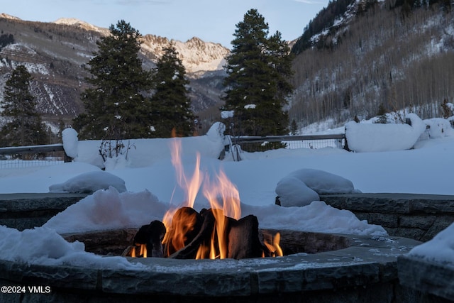 exterior details with a mountain view and a fire pit