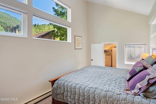 4031 Bighorn Rd Unit 9-H, Vail, CO 81657 - bedroom featuring baseboard heating, a high ceiling, and a walk in closet