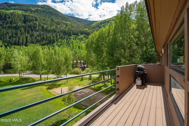 4031 Bighorn Rd Unit 9-H, Vail, CO 81657 - wooden terrace with a wooded view and a mountain view