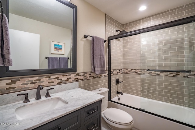 4031 Bighorn Rd Unit 9-H, Vail, CO 81657 - full bath featuring tile walls, vanity, and combined bath / shower with glass door