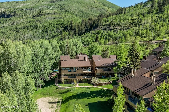4031 Bighorn Rd Unit 9-H, Vail, CO 81657 - bird's eye view of a heavily wooded area and mountains