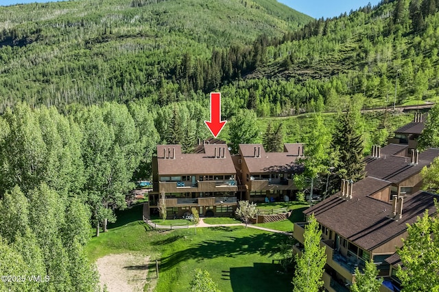 4031 Bighorn Rd Unit 9-H, Vail, CO 81657 - drone / aerial view of a forest and mountains