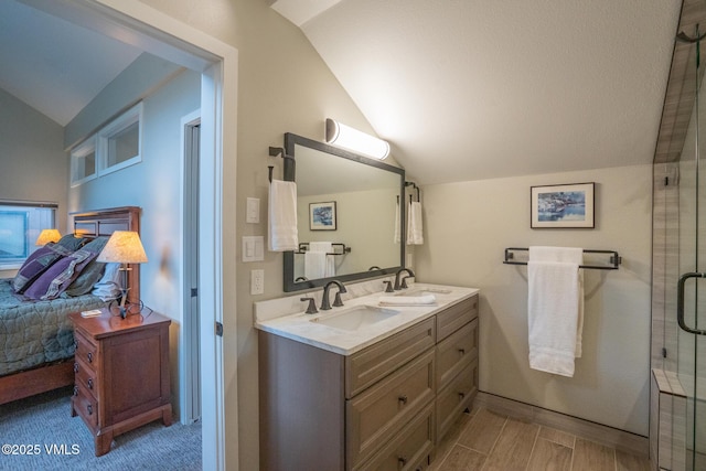 4031 Bighorn Rd Unit 9-H, Vail, CO 81657 - full bath with lofted ceiling, connected bathroom, double vanity, and an enclosed shower
