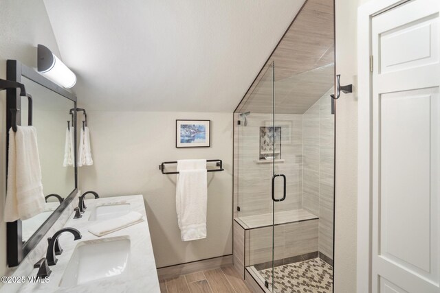 4031 Bighorn Rd Unit 9-H, Vail, CO 81657 - full bath featuring double vanity, a stall shower, and vaulted ceiling