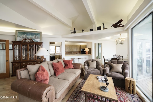 4747 Wildridge Rd, Avon, CO 81620 - living area with an inviting chandelier, wood finished floors, a healthy amount of sunlight, and beamed ceiling