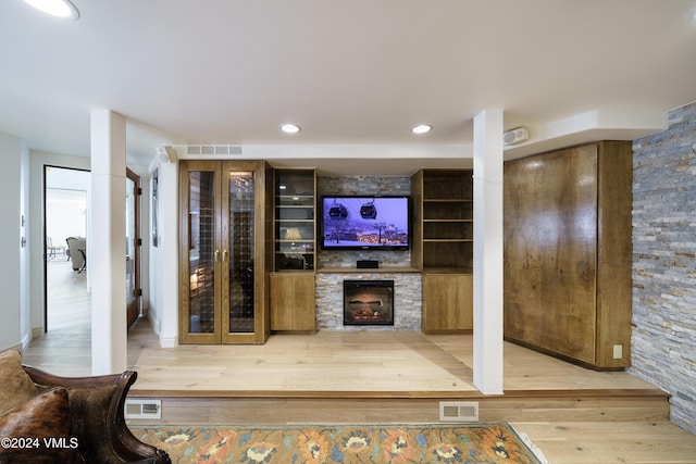 4747 Wildridge Rd, Avon, CO 81620 - living area with a fireplace, wood finished floors, and visible vents