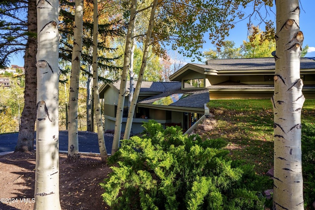 4747 Wildridge Rd, Avon, CO 81620 - view of side of home with a shingled roof