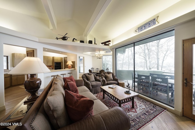 4747 Wildridge Rd, Avon, CO 81620 - living area featuring vaulted ceiling with beams and wood finished floors