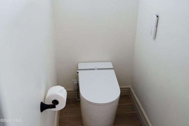4747 Wildridge Rd, Avon, CO 81620 - bathroom featuring toilet, baseboards, and wood finished floors