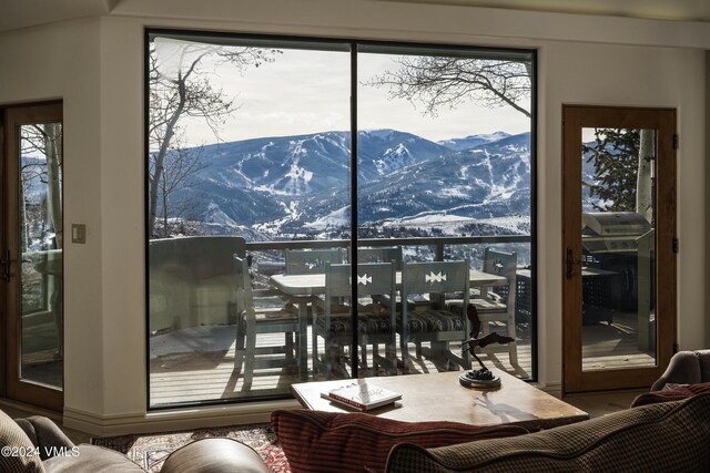 doorway to outside featuring a mountain view