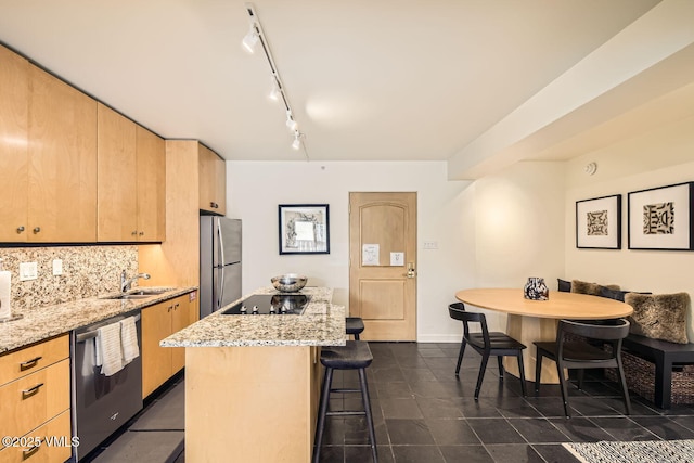 kitchen featuring a breakfast bar area, light brown cabinets, stainless steel appliances, a kitchen island, and backsplash