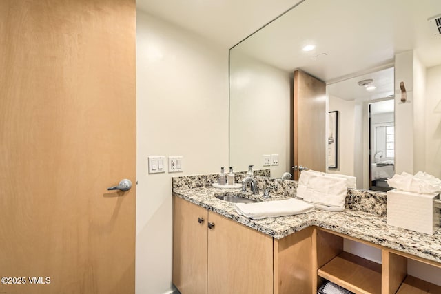 bathroom featuring visible vents and vanity