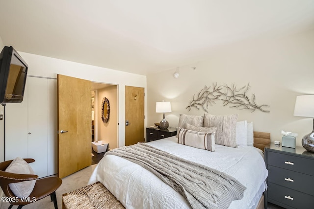 bedroom featuring light carpet