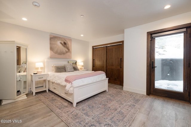 bedroom featuring access to outside, light wood-style flooring, and recessed lighting