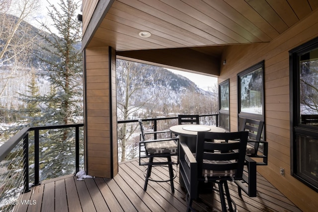 wooden terrace with a mountain view