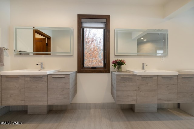 bathroom with two vanities and a sink