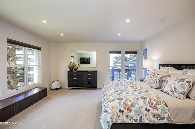 bedroom featuring recessed lighting, baseboards, light colored carpet, and access to exterior