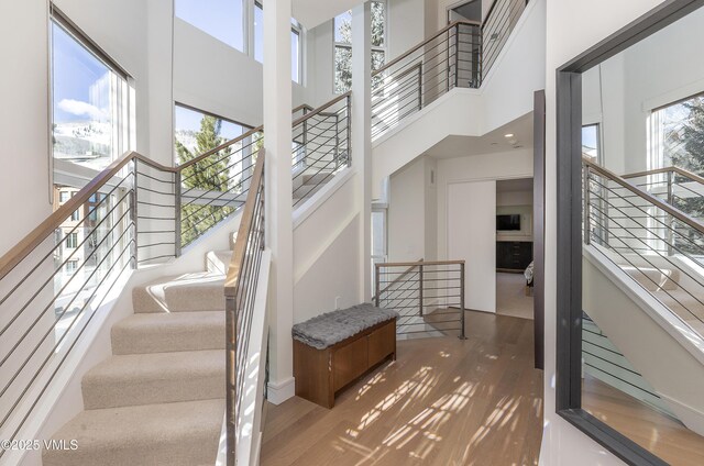 townhome / multi-family property featuring stucco siding, a garage, a mountain view, and a chimney