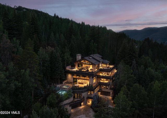 100 Vail Rd, Vail, CO 81657 - aerial view of a forest and mountains