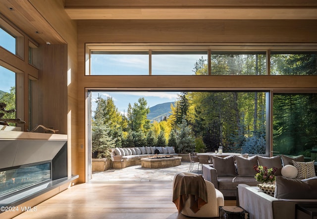 100 Vail Rd, Vail, CO 81657 - living room with hardwood / wood-style flooring, a mountain view, and plenty of natural light
