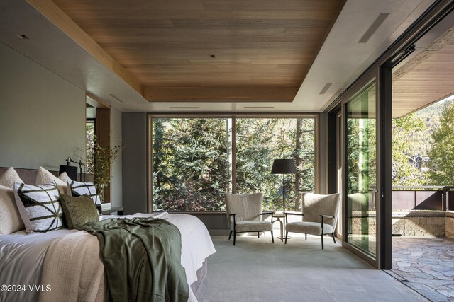 100 Vail Rd, Vail, CO 81657 - bedroom with multiple windows, floor to ceiling windows, wood ceiling, access to outside, and a tray ceiling