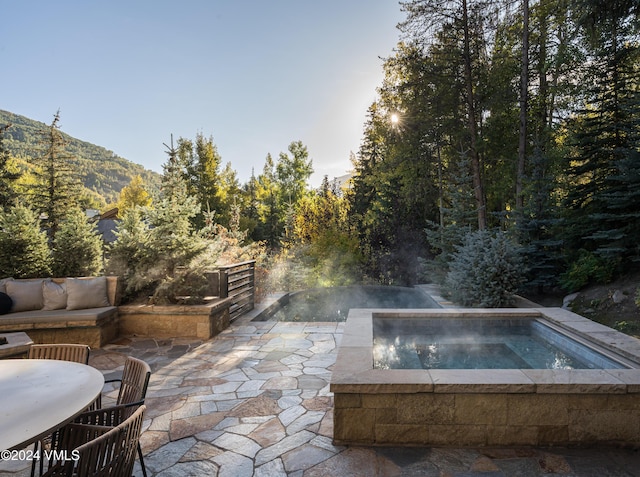 100 Vail Rd, Vail, CO 81657 - view of patio with an in-ground hot tub