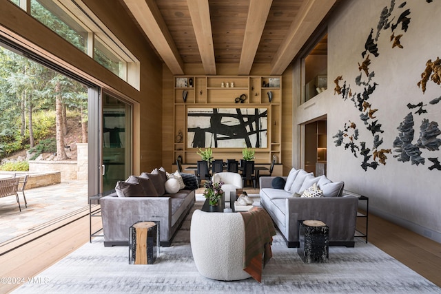100 Vail Rd, Vail, CO 81657 - living area with hardwood / wood-style flooring, a wooden ceiling with exposed beams, and a towering ceiling