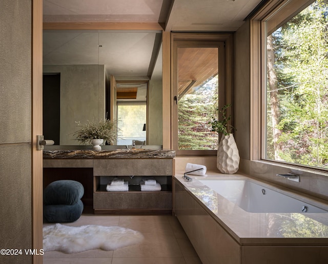 100 Vail Rd, Vail, CO 81657 - bathroom with vanity, a garden tub, plenty of natural light, and tile patterned flooring