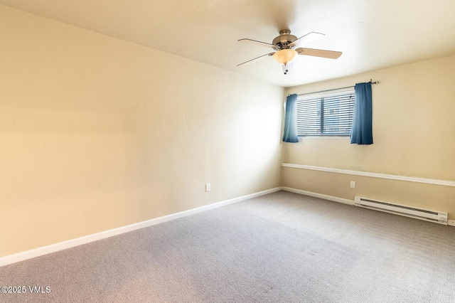 spare room featuring a baseboard heating unit, baseboards, ceiling fan, and carpet flooring