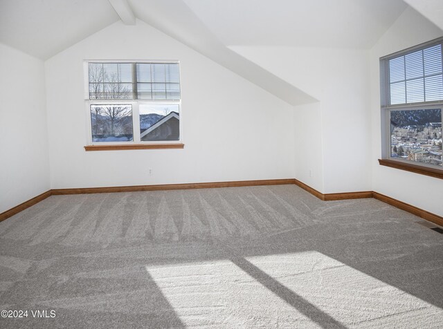 49 Bluffs Dr, Eagle, CO 81631 - additional living space with lofted ceiling with beams and carpet