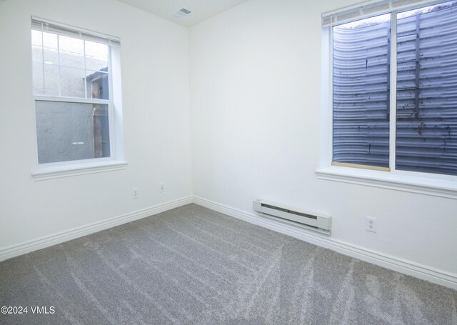 49 Bluffs Dr, Eagle, CO 81631 - spare room with carpet floors and a baseboard radiator