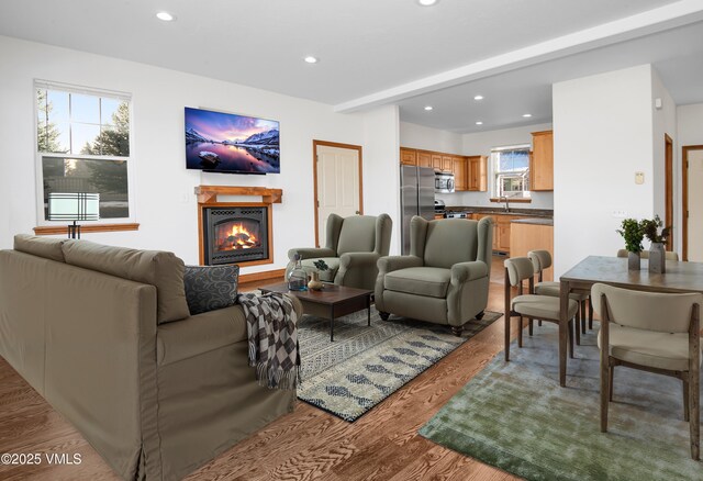 49 Bluffs Dr, Eagle, CO 81631 - living room featuring beam ceiling and light hardwood / wood-style flooring