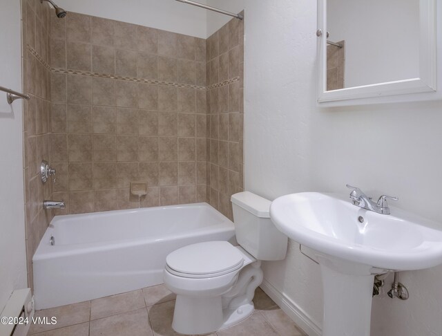 49 Bluffs Dr, Eagle, CO 81631 - bathroom with baseboard heating, tiled shower / bath, tile patterned floors, and toilet