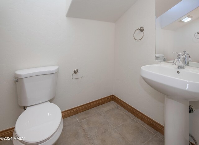 49 Bluffs Dr, Eagle, CO 81631 - bathroom with sink, tile patterned floors, and toilet