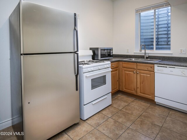 49 Bluffs Dr, Eagle, CO 81631 - kitchen featuring sink, light tile patterned floors, and stainless steel appliances
