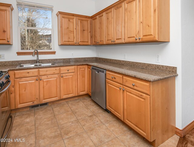 49 Bluffs Dr, Eagle, CO 81631 - kitchen featuring sink, light tile patterned floors, and appliances with stainless steel finishes