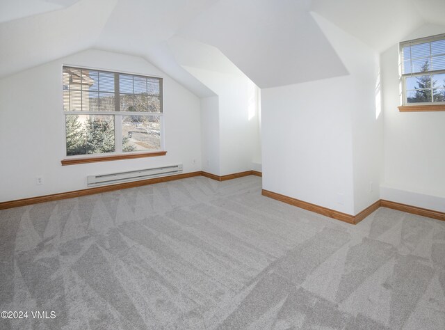 49 Bluffs Dr, Eagle, CO 81631 - bonus room with vaulted ceiling, a baseboard heating unit, and light colored carpet