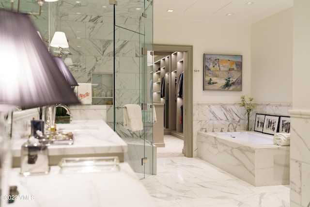17 Chateau Ln Unit 501, Beaver Creek, CO 81620 - full bathroom featuring a garden tub, a marble finish shower, marble finish floors, a walk in closet, and recessed lighting