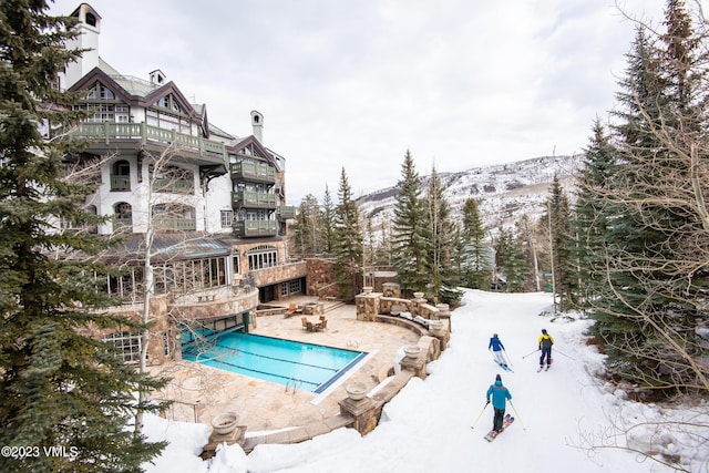 17 Chateau Ln Unit 501, Beaver Creek, CO 81620 - snow covered pool with a community pool and a patio area