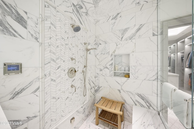 17 Chateau Ln Unit 501, Beaver Creek, CO 81620 - full bathroom featuring a marble finish shower and tile walls