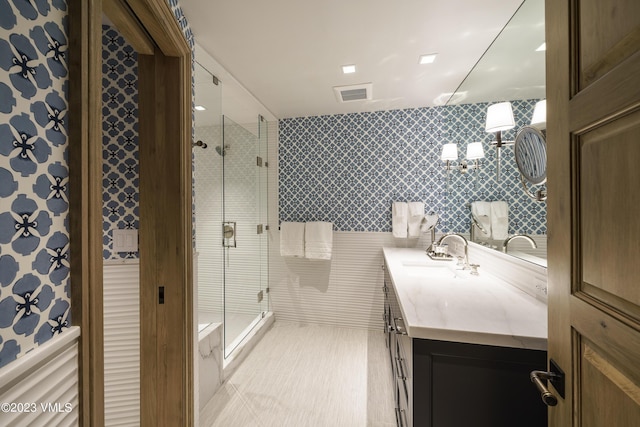 17 Chateau Ln Unit 501, Beaver Creek, CO 81620 - full bath featuring vanity, a shower stall, and tile walls