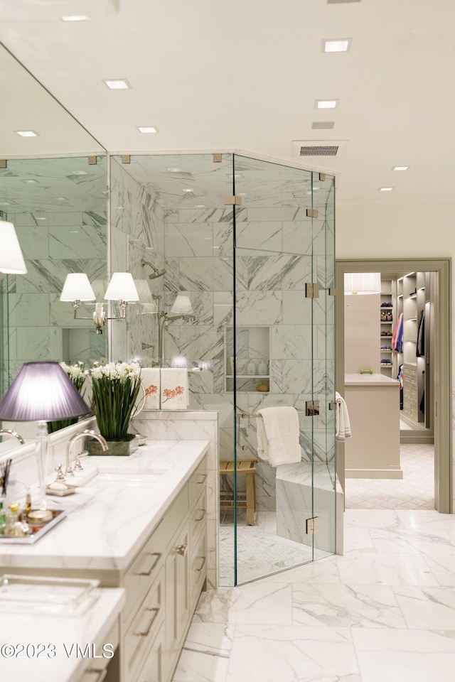 17 Chateau Ln Unit 501, Beaver Creek, CO 81620 - full bathroom with vanity, a marble finish shower, marble finish floors, and recessed lighting